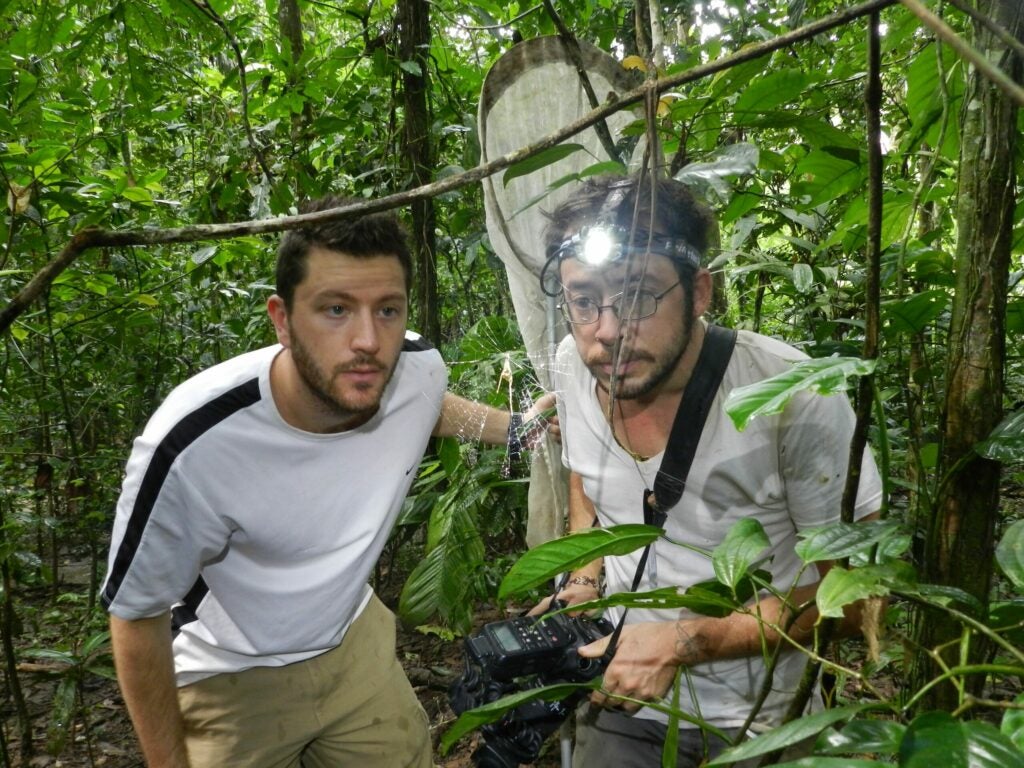 Aaron Pomerantz, left, and Larry Reeves inspect a decoy web, that is looking somewhat sad after a recent rain.