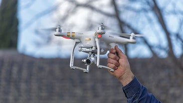 a man holding the DJI Phantom 3 Professional drone