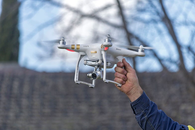a man holding the DJI Phantom 3 Professional drone
