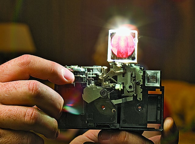 A 1970s-era MagiCube flashbulb ignites when a wire knocks a tube containing a shock-sensitive primer.