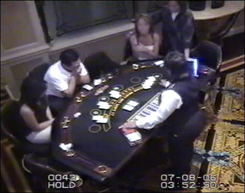 In 2002, a husband-and-wife team of card dealers in San Diego launched a card-cheating scam that would ultimately involve over 40 accomplices and net up to $7 million from 29 casinos during a 5 year run. The Trans would corrupt dealers into the scam in order to execute the sleight-of-hand called the "false shuffle." Using a cellphone or a miniature transmitter on the lapel, spotters near the table during normal play would relay the order of a "slug," or section of the deck, to a game analyst off-site.* The dealer would then perform the "false shuffle" -- fooling the overhead surveillance camera by appearing to shuffle the deck, while leaving the "slug" intact. The game analyst used card tracking software to determine winning hands and then transmitted them back to the spotters, who would use hand signals for what the players should do -- "almost like a catcher giving signs to the pitcher in baseball," says FBI special agent Peter Casey.