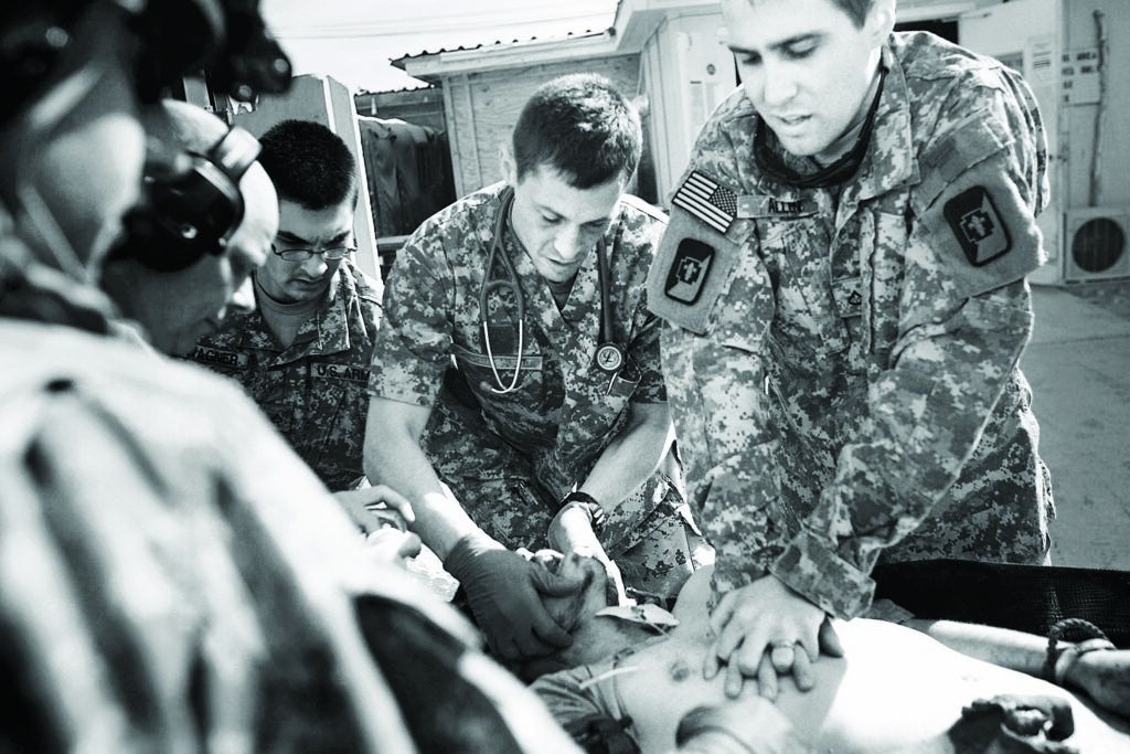 Medics at field hospitals like this one in Kandahar, Afghanistan, have little time to save trauma patients.