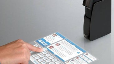 A Mobile Touchscreen Projectable On Any Flat Surface