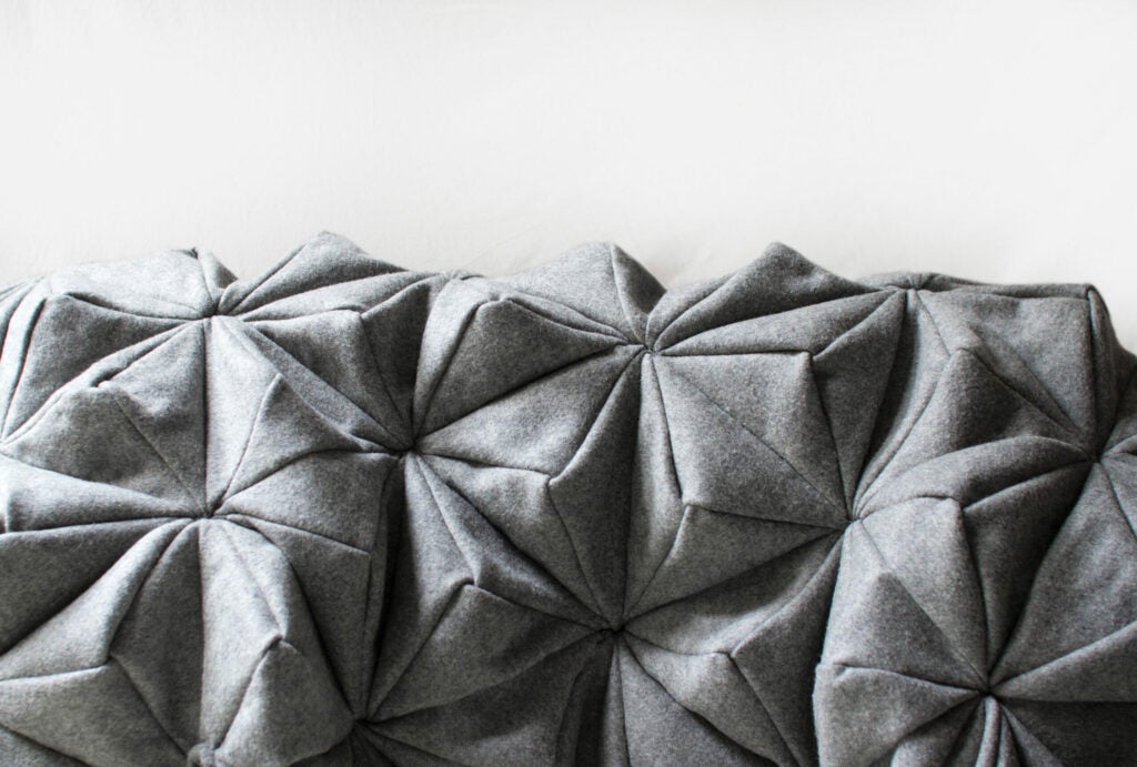 Who decided blankets need to be flat? Design studio Oak Form took inspiration from origami (and tessellations). The result is a cashmere blanket that looks like it belongs in a geometry book. <strong>$300</strong>