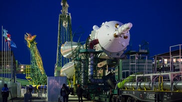 Soyuz rocket is wheeled to launchpad