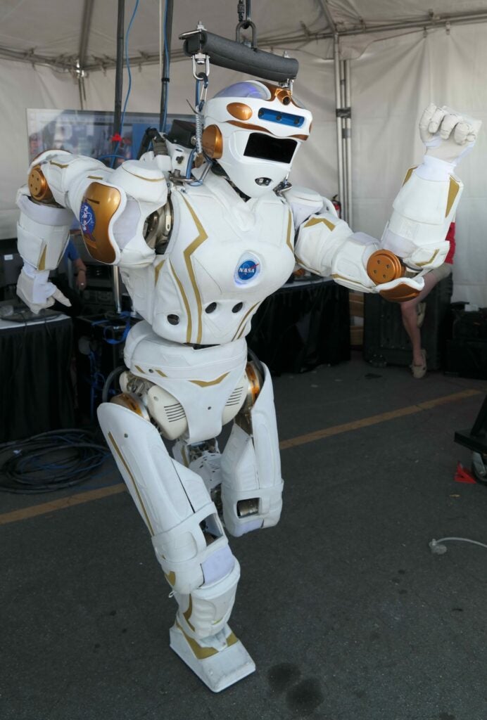 NASA's Valkyrie humanoid robot in a running pose at the DRC