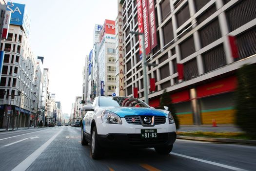 The electric taxi cruises through Tokyo.