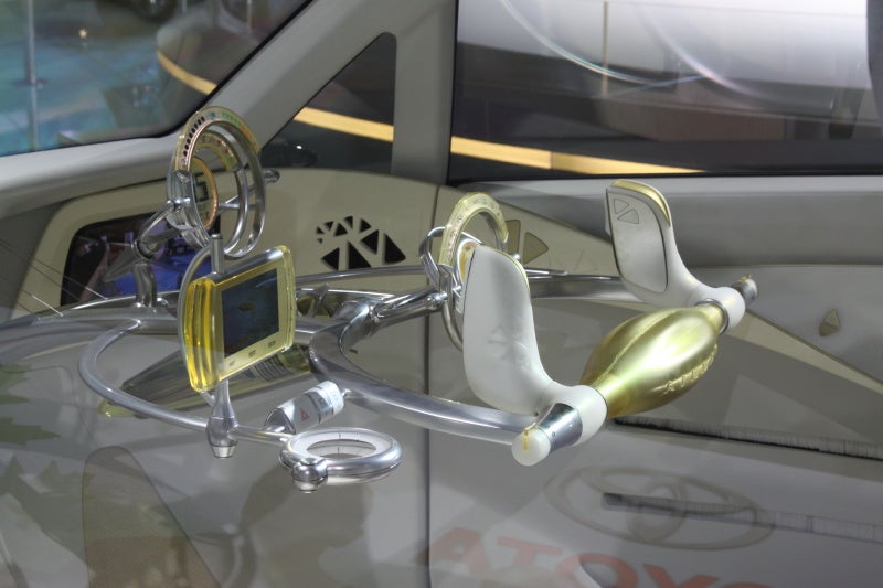 Probably the most unusual concept at the show, the Toyota FT-EVII, which first appeared at last year's Tokyo auto show, features whacked-out styling and a dentist-of-the-future steering "wheel" that confused us thoroughly.