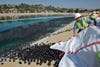 three million black polyethylene balls on the beach