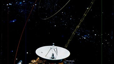 Voyager 1 flying past Saturn, with Jupiter and the inner solar system visible in the background