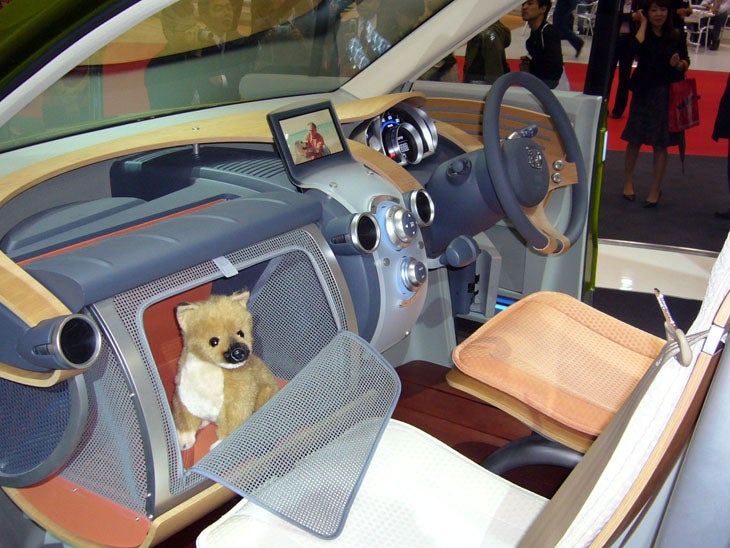 Dogs across the globe have been barking for years for a canine-oriented car-or at least that's what Honda seems to think. The WOW concept features a pee-resistant wood floor (well, it stands up better than carpet), a glove box small-dog holder, and a crate that pops up from under the second-row seats to accommodate a more substantial Rover.