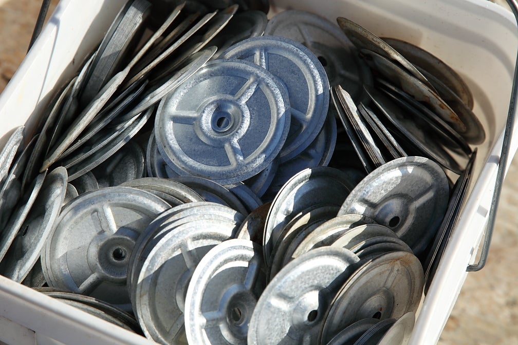 A box of flat metal washers.