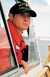 Coxswain Chuck Ashmore keeps an eye out for trouble on San Francisco Bay.