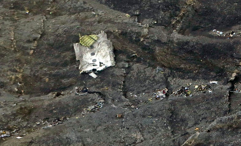 Debris from crashed Germanwings Airbus A320 are seen in the mountains, near Seyne-les-Alpes, March 24, 2015. French investigators on Wednesday searched for the reason why a German Airbus ploughed into an Alpine mountainside, killing all 150 on board including 16 teenagers returning from a school trip to Spain. Picture taken March 24, 2015. REUTERS/Thomas Koehler/photothek.net/Pool - RTR4USQ0