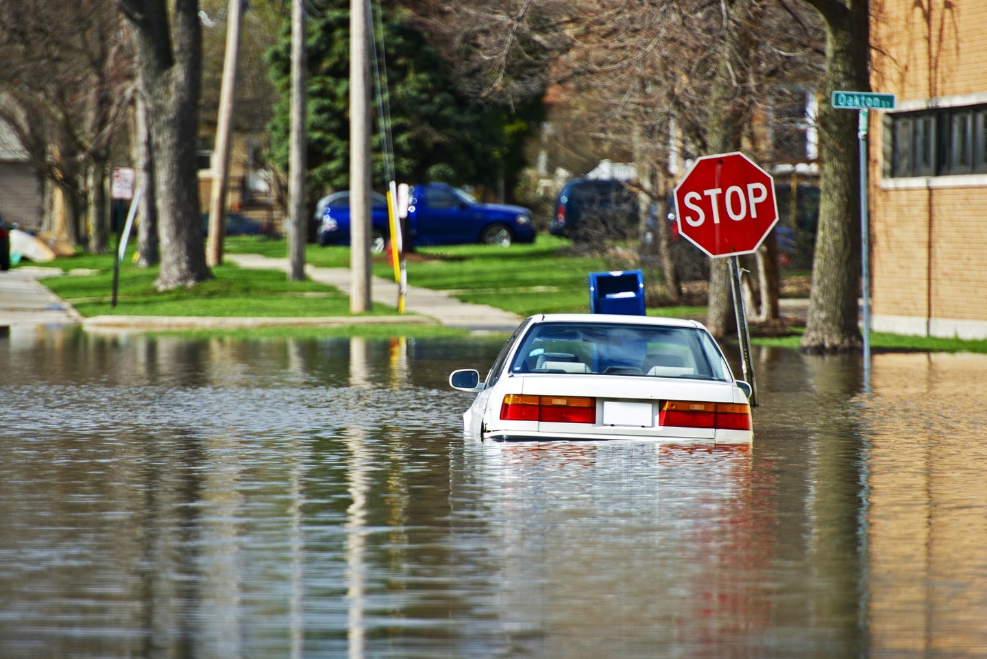 Car Under Water. Vehicle Flooded by River Flood in Des Plains, IL, USA. Flooded City Streets After Few Days of Intense Rain. Nature Disasters Photo Collection.