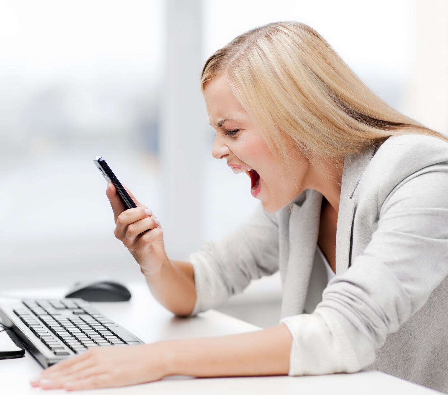 picture of angry woman shouting at phone
