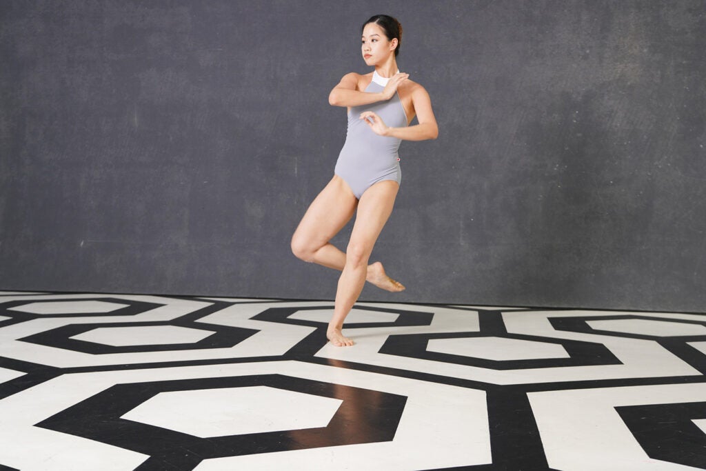 dancer on black and white geometrical floor