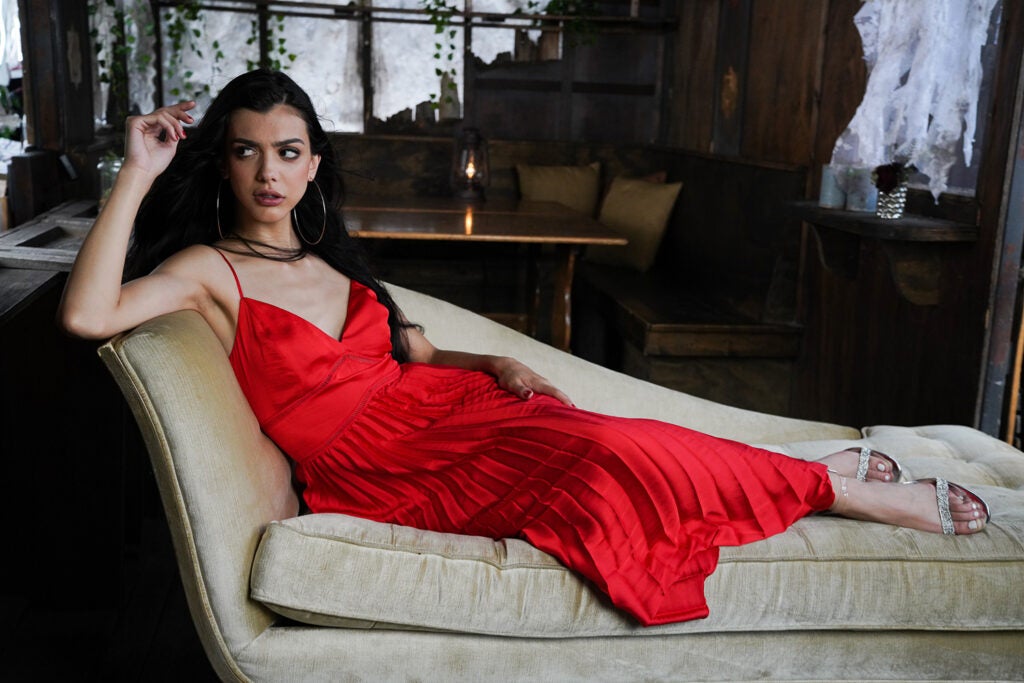 woman in red dress lounging