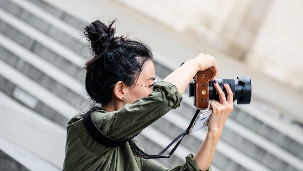 Woman holding digital camera