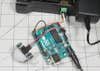 A motion sensor, an Arduino Uno, and a power relay