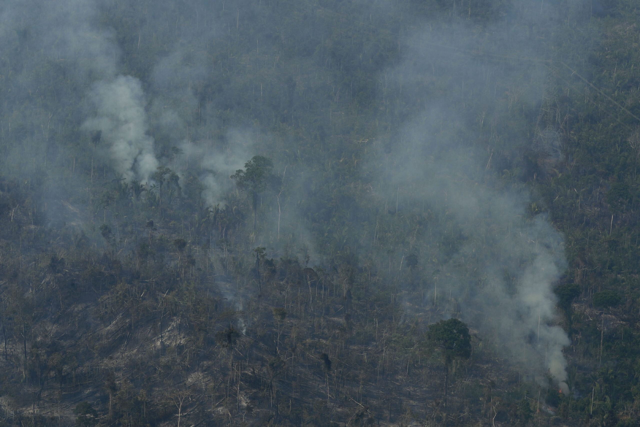 Fire consumes an area near Jaci Parana, state of Rondonia, Brazil, Saturday, Aug. 24, 2019. Brazil says military aircraft and 44,000 troops will be available to fight fires sweeping through parts of the Amazon region. The defense and environment ministers have outlined plans to battle the blazes that have prompted an international outcry as well as demonstrations in Brazil against President Jair Bolsonaro's handling of the environmental crisis. (AP Photo/Eraldo Peres)