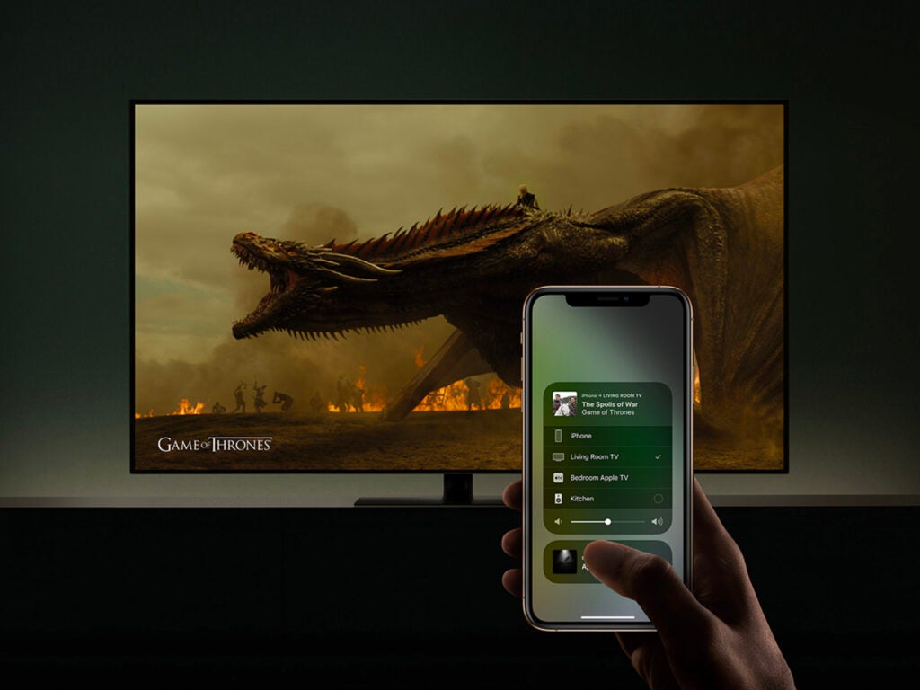 Person with iPhone streaming Game of Thrones to a TV
