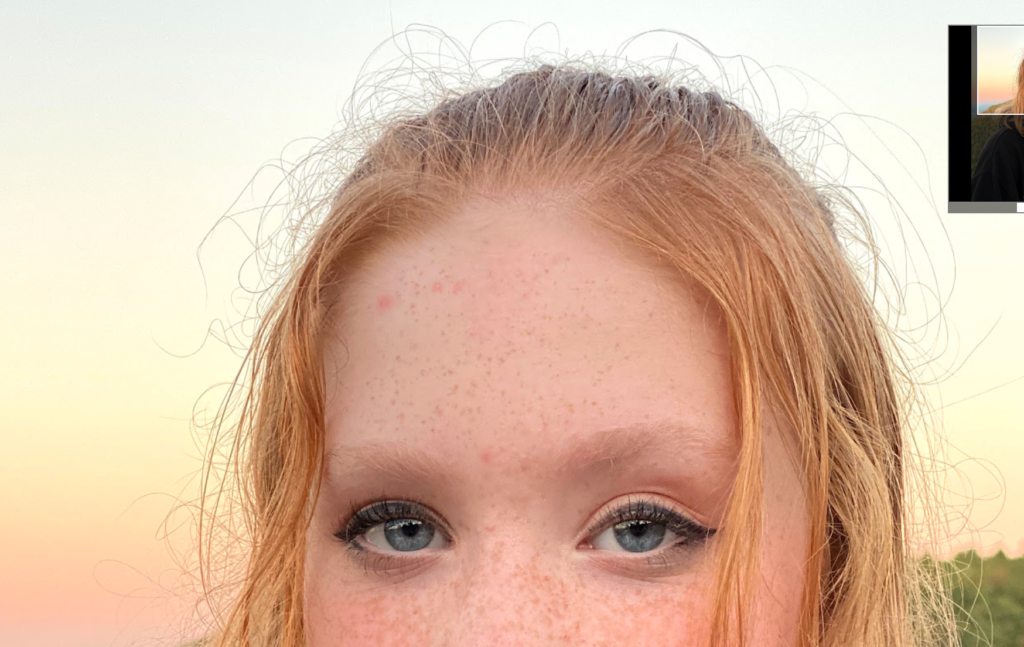 Closeup of a girl's frizzy head taken by iPhone 11 Pro camera