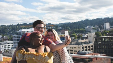 three plus-size women take a selfie