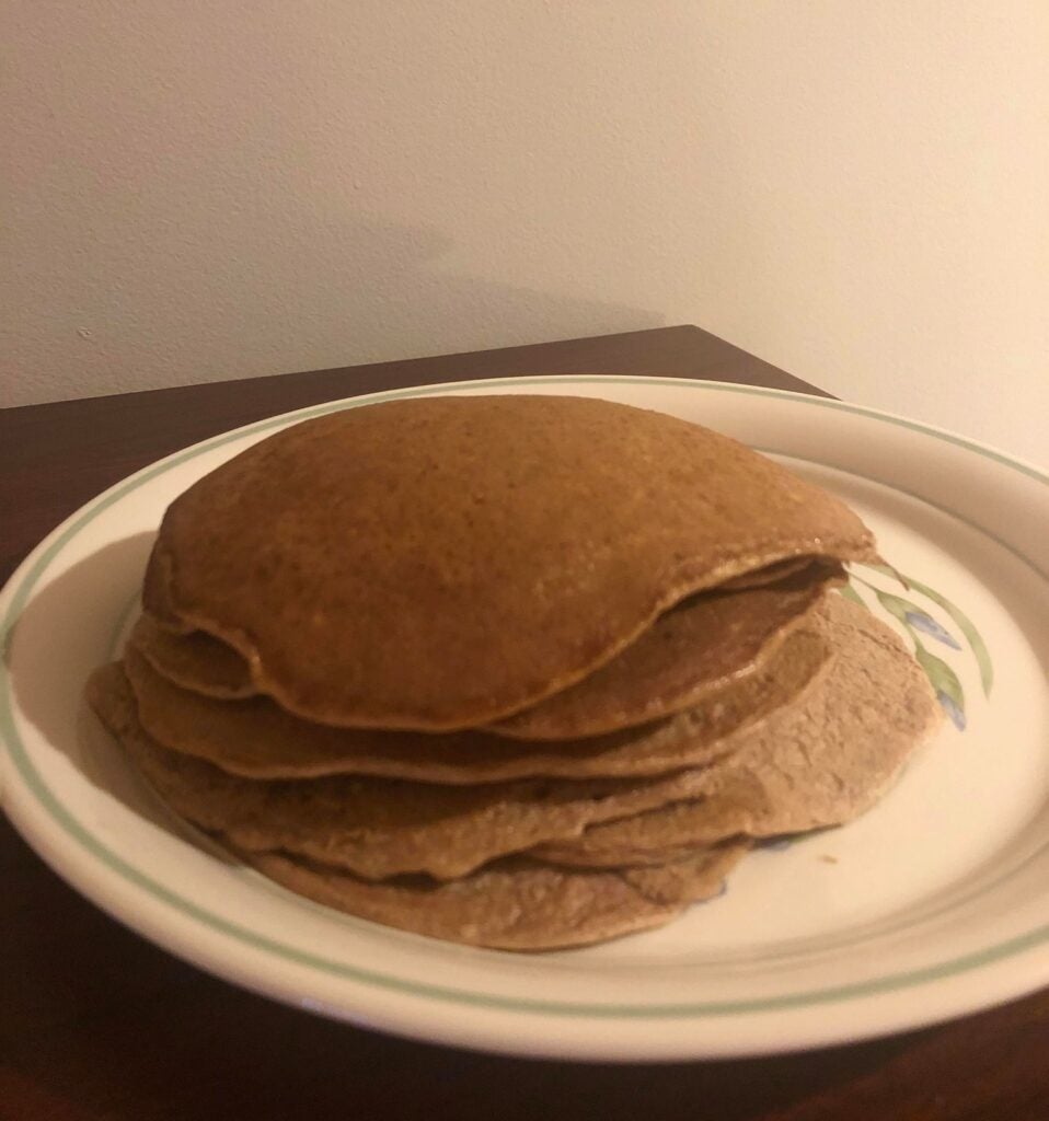 Stack of flourless pancakes on a white plate