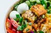Salad with eggs, tomatoes, green leafs and tofu