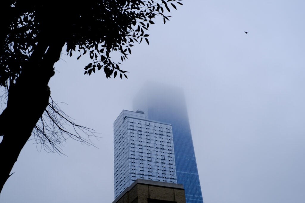 skyscraper clouded in fog