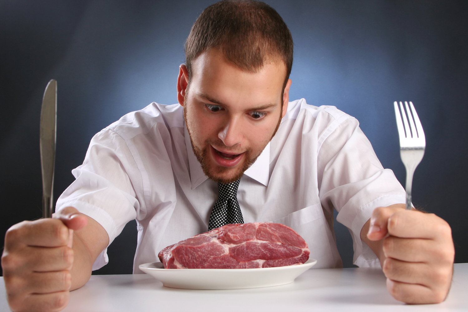 eccentric guy eating red meat