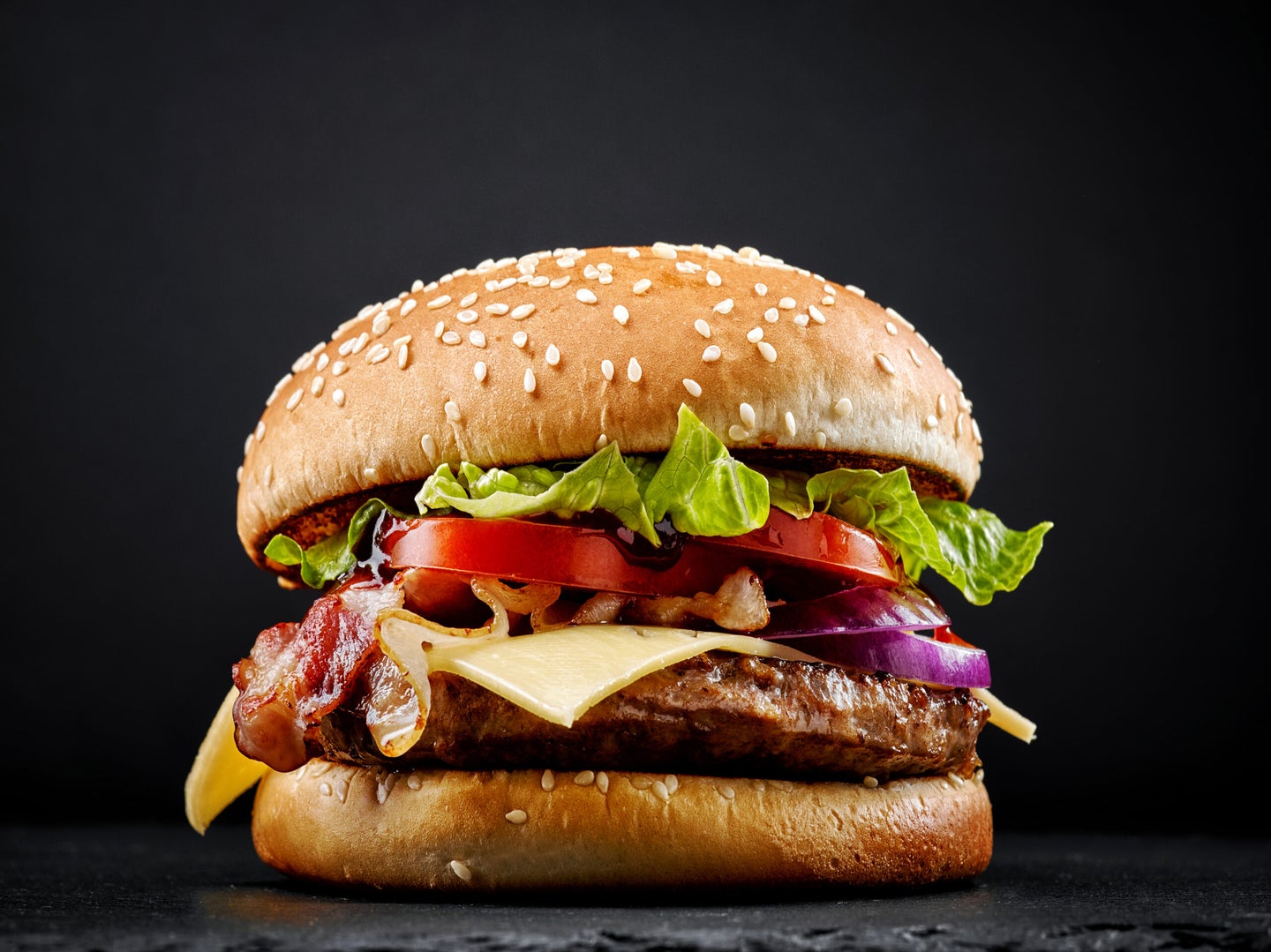 Burger on black background.