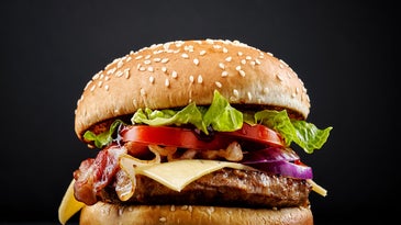 Burger on black background.