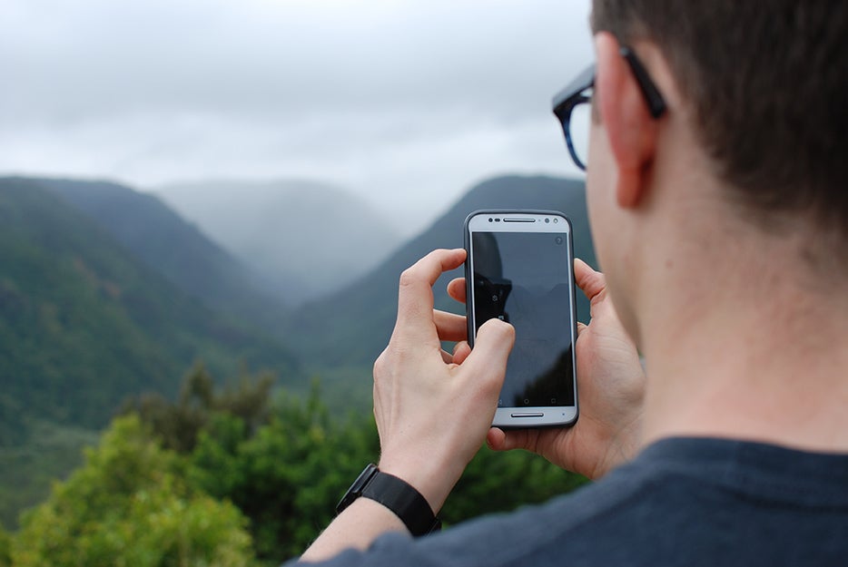 man on phone on a mountain