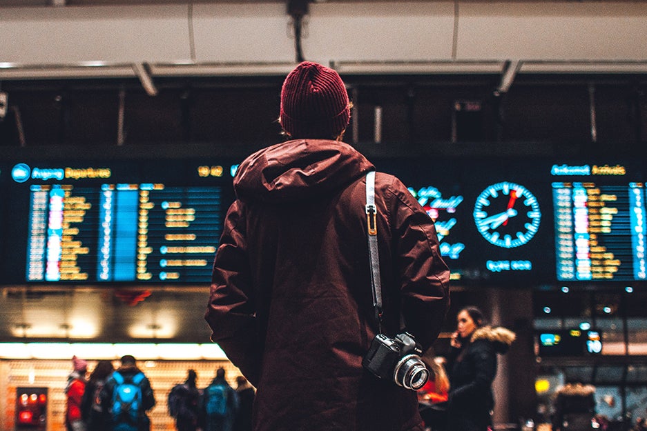 man standing in a train station