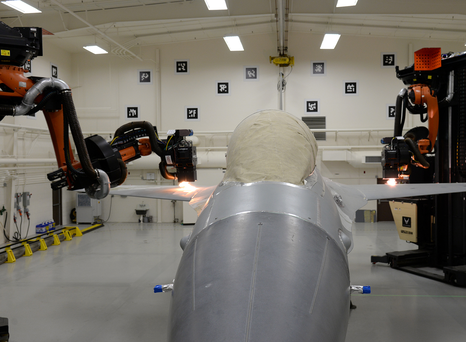 The best way to strip paint off a fighter jet? Laser-wielding robots.