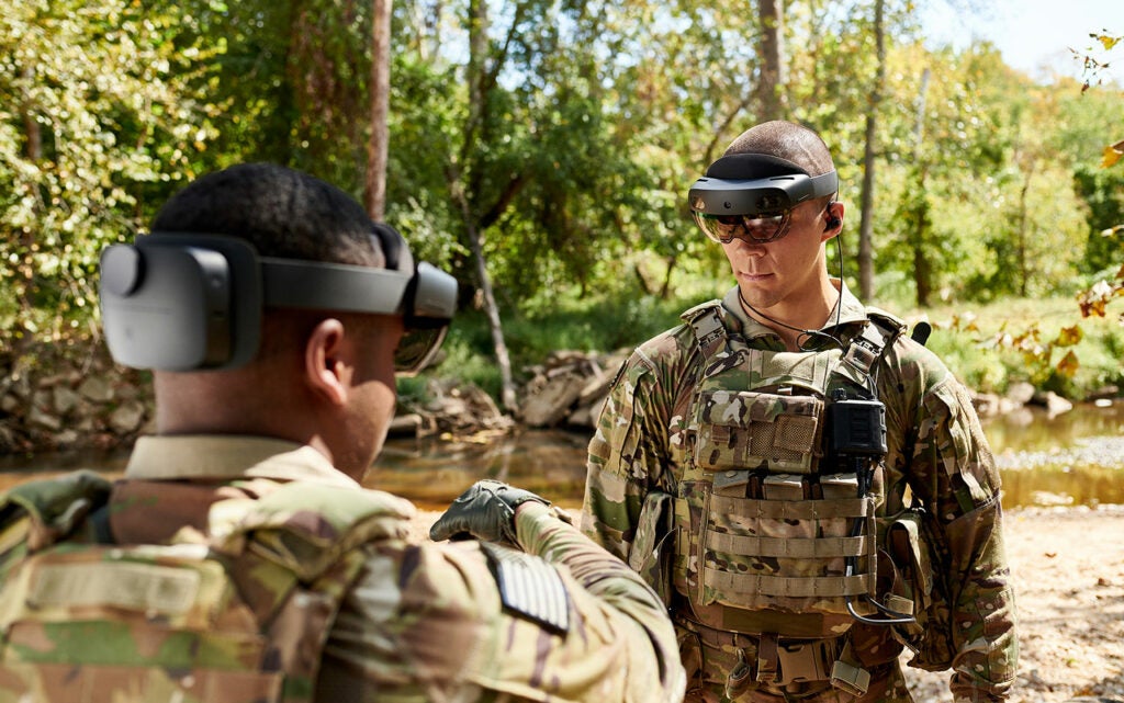Two army officers wearing an Integrated Visual Augmentation System by US Army Futures Command and Microsoft