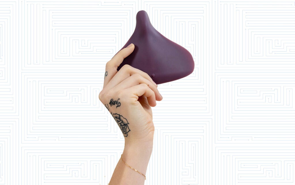 person holding the Enby Gender Neutral Sex Toy by Wild Flower