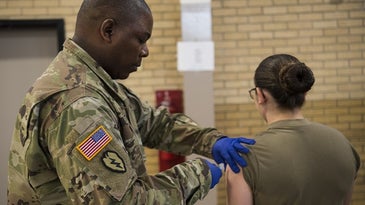 A U.S. service member gets a flu vaccination.