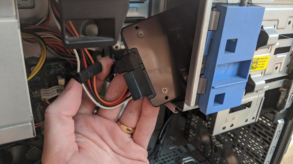 Hand inside of PC tower