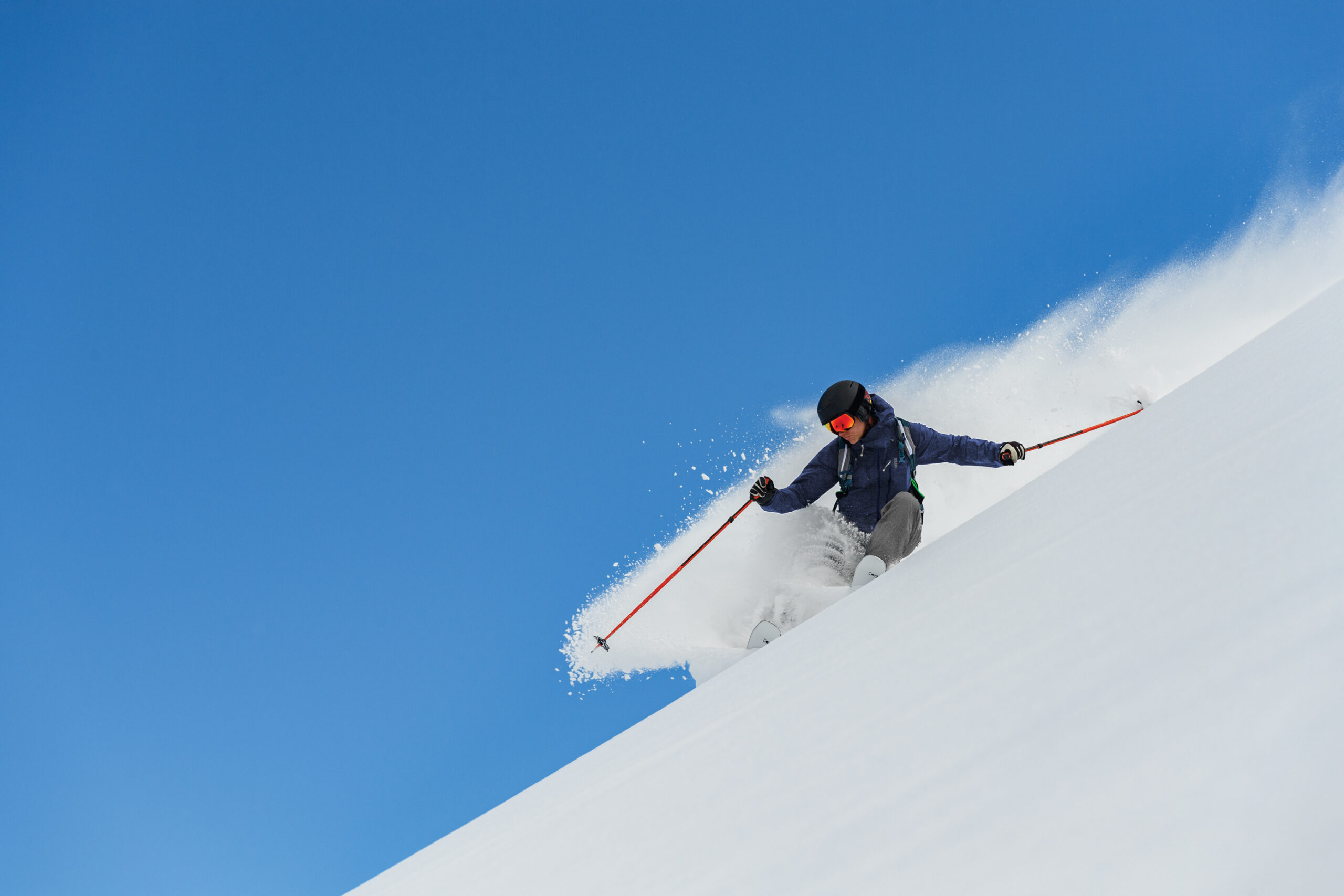 person skiing down a mountain