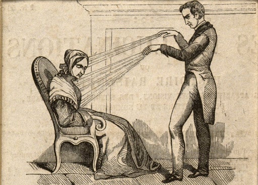a man hypnotizing a woman