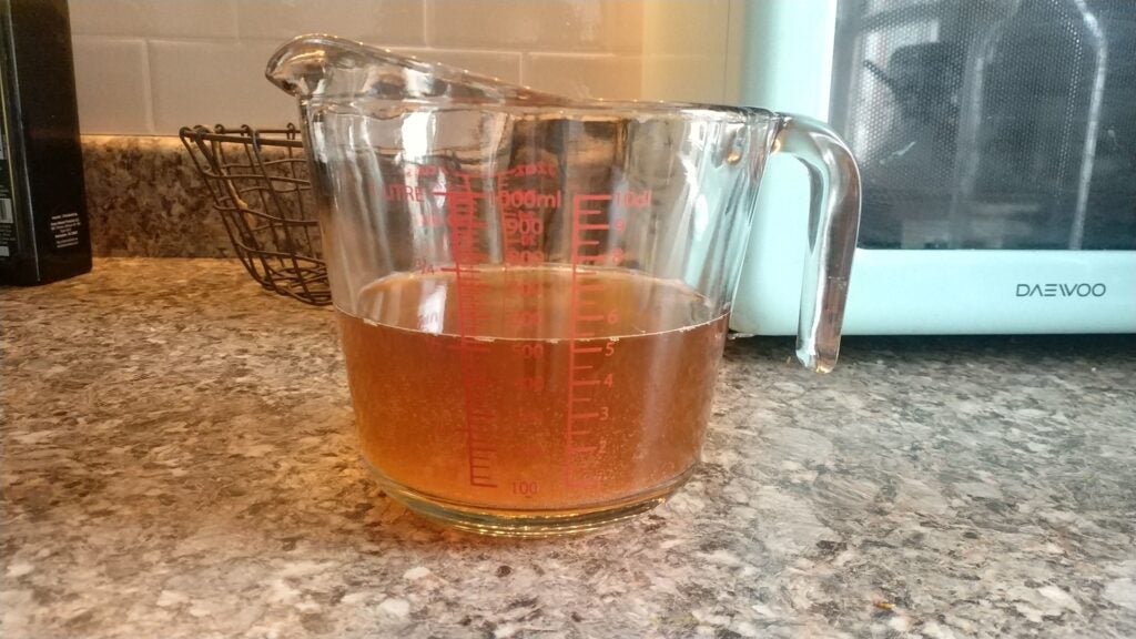 Measuring cup with starter tea