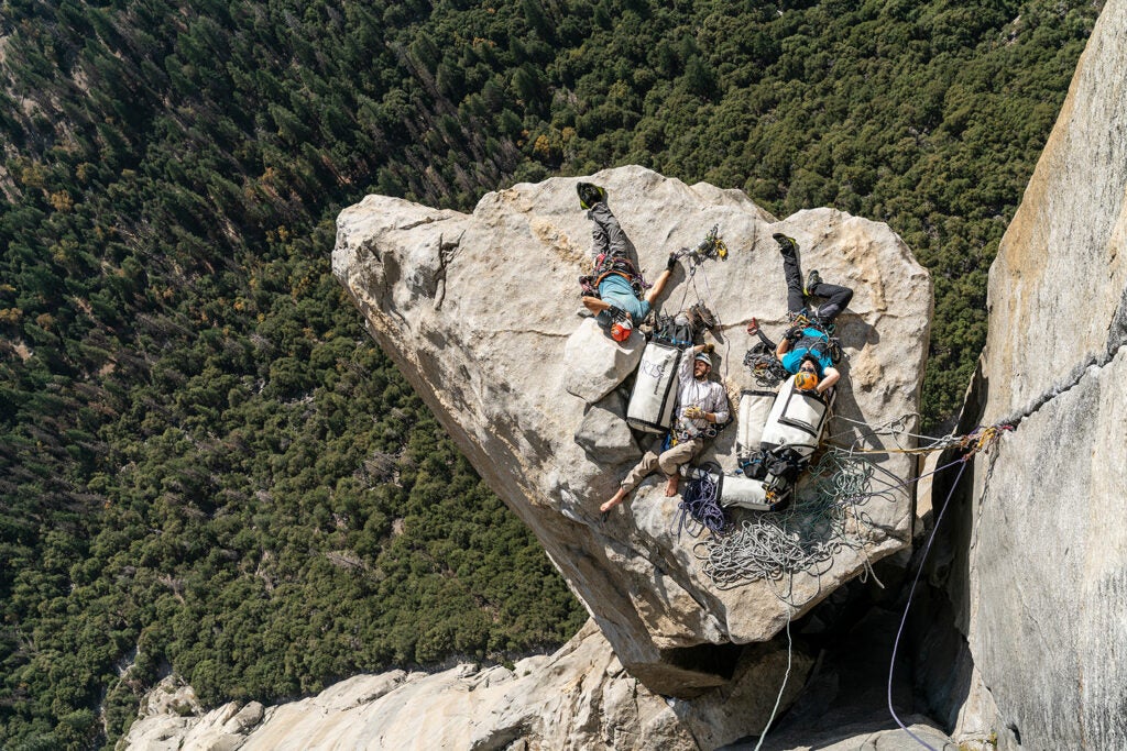 climbers napping on a cliff by Salathé Wall