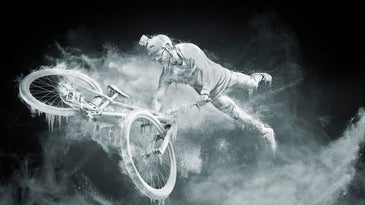 Paul Alekhin covered in ice and snow on bicycle