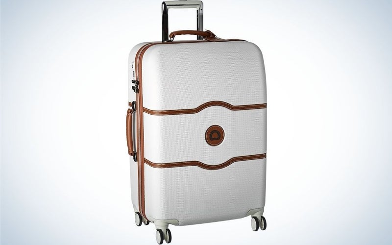 Champagne White Hardside Luggage with Spinner Wheels designed with stylish faux leather accents from front.