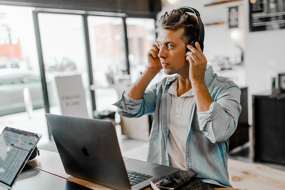 guy wearing headphones in an office