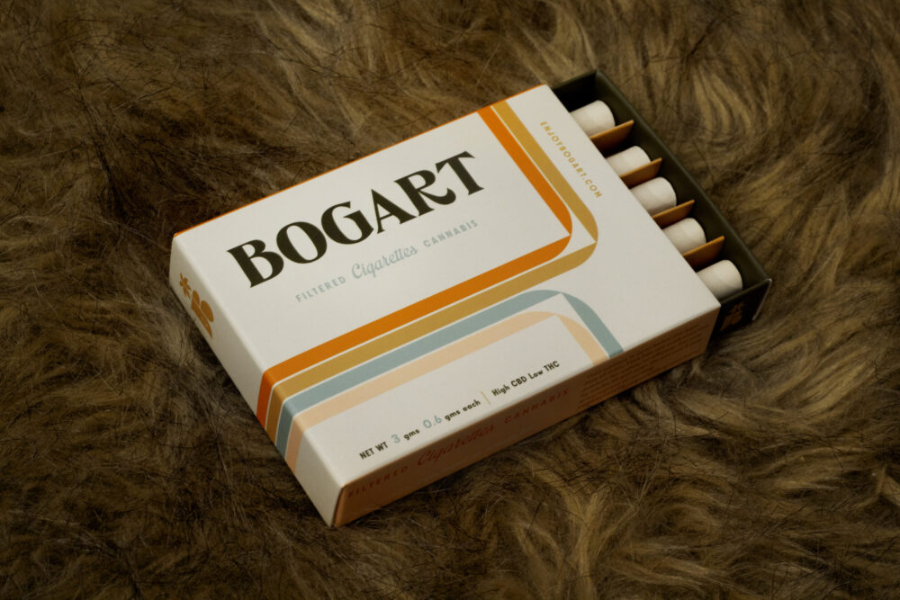 A pack of Bogarts on a dark orange shag carpet
