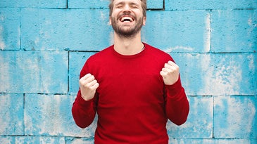 man in a red sweater smiling
